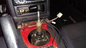 Lower shifter boot has 3 bolts