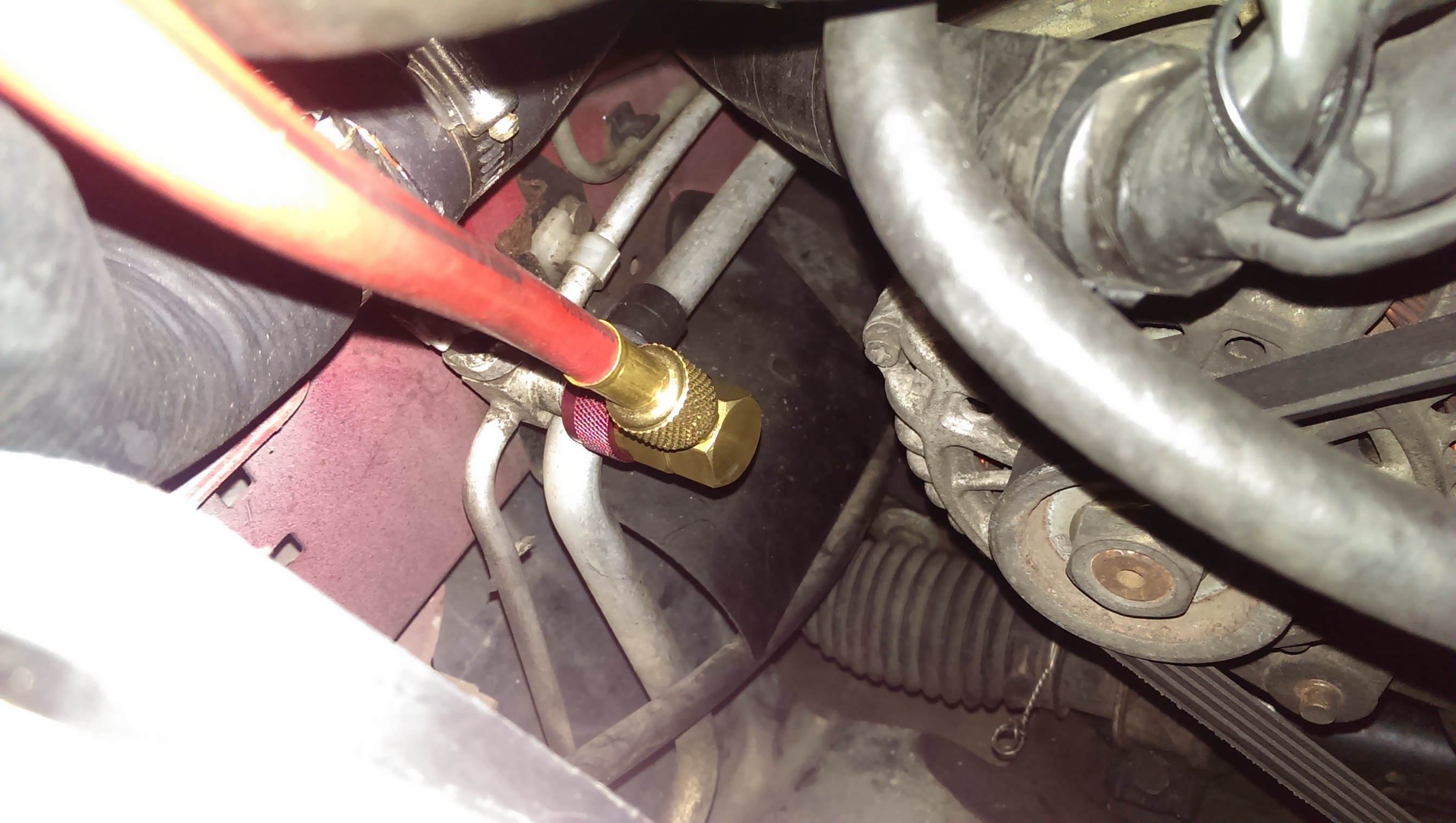 How do you repair a broken air conditioning hose on a car?