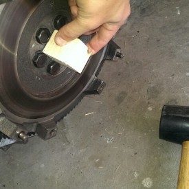 Tapping in the pilot bearing flush with a block of wood