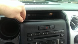 Remove the trim on top of the radio