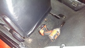 Two bolts plus seatbelt bolt
