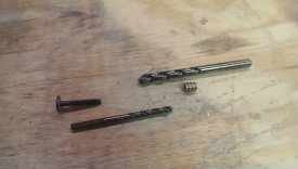 The furniture bolt, matching threaded insert, and drill bits for each