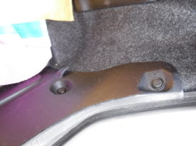 Access the brake light behind this trim panel