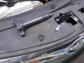 Coil after it's been removed, along with the bolt