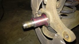 Axle grease liberally coating the wheel spindle