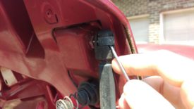 Pry off this C-clip with a screwdriver