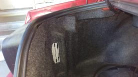 There's a fuel pump switch in the trunk on the driver's side behind this panel