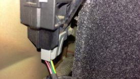 With the car running, unplug this plug