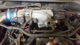 Clean the mating surface before installing the new IACV