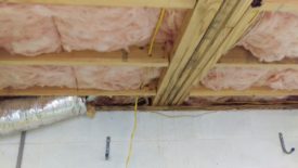 Drilling holes to go through the joists as needed