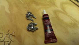 Cable clamps and thread locker