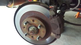 Get the back of the car on jack stands, and remove the wheels