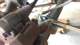 Remove the cap from the rear brake adjuster