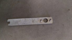 Alternately, one of these angle grinder wrenches can work in a pinch