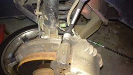 The top front caliper bolt