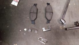 Two shims for the pads, one for the caliper