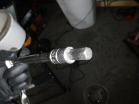You need a 10mm allen key or socket