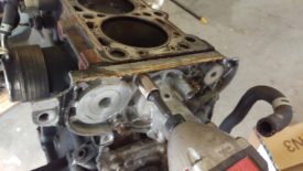 Remove these bolts to disconnect the water pump