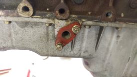 After removal, threaded nuts back onto the pan