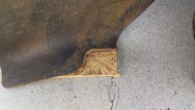 Using the grass deflector to cut away the left side