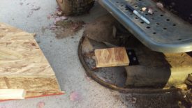 Attached to mower deck where it will be
