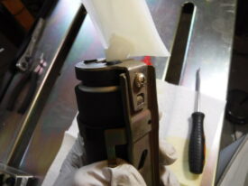 Bolt the sock bracket or whatever this is with the phillips screw