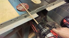 Chuck the dowel rod in the drill, like a bit