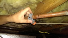 A cheap pipe cutter works fine