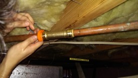 Using the push tongs to slide the fitting back over