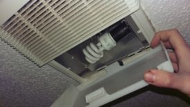 First, the bulb cover is opened and the lightbulb removed