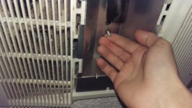 These nuts screwed onto studs hold the fan cover on