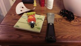 Wood filler and a putty knife