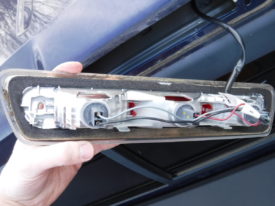 The brake light removed, old gasket visible
