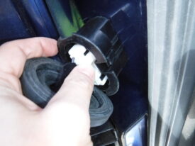 Push this tab to unplug the door