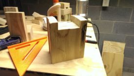 The notches in the side panels will keep the tool from sliding off