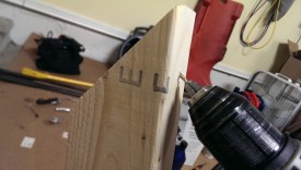 Drilling an angled pilot hole will help the screw go into the side piece straight