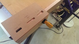 Cutting the longer mortise for the main member on the far edge of the board