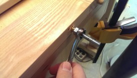 Use a wrench on the second nut to drive it in