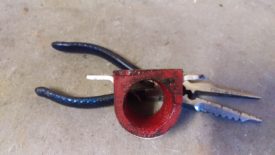 The racing beat bushing extends past the bracket that holds it