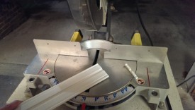 Trimming the cover with a miter saw