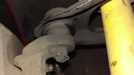 Undo the cotter pin and unbolt the upper ball joint