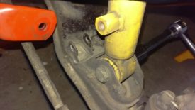Remove the lower shock bolt