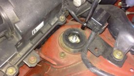 Removing the first upper shock nut