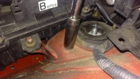 Removing the second upper shock nut