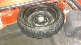Remove the spare tire to get to the passenger side shock mount