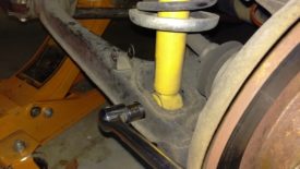 Break the lower shock bolts loose