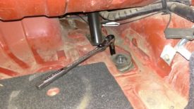 Remove upper shock mount nuts