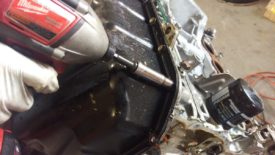 Remove all of the oil pan bolts