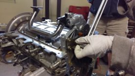 Guide / tensioner is reinstalled with the same three bolts