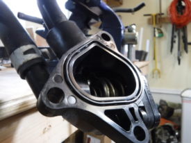 The engine side of the thermostat housing